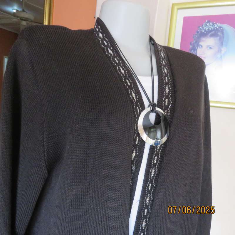 Black acrylic knit long sleeve knitted button down cardigan. Silver thread fronts-pockets. Size 44