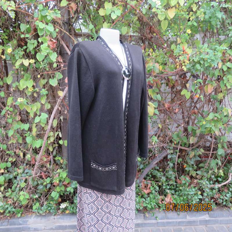 Black acrylic knit long sleeve knitted button down cardigan. Silver thread fronts-pockets. Size 44