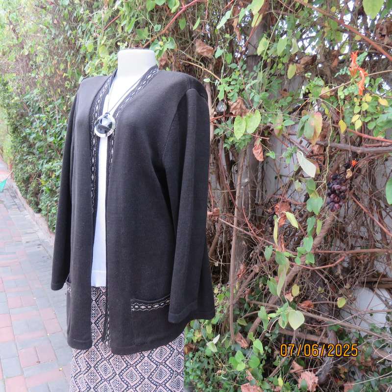 Black acrylic knit long sleeve knitted button down cardigan. Silver thread fronts-pockets. Size 44