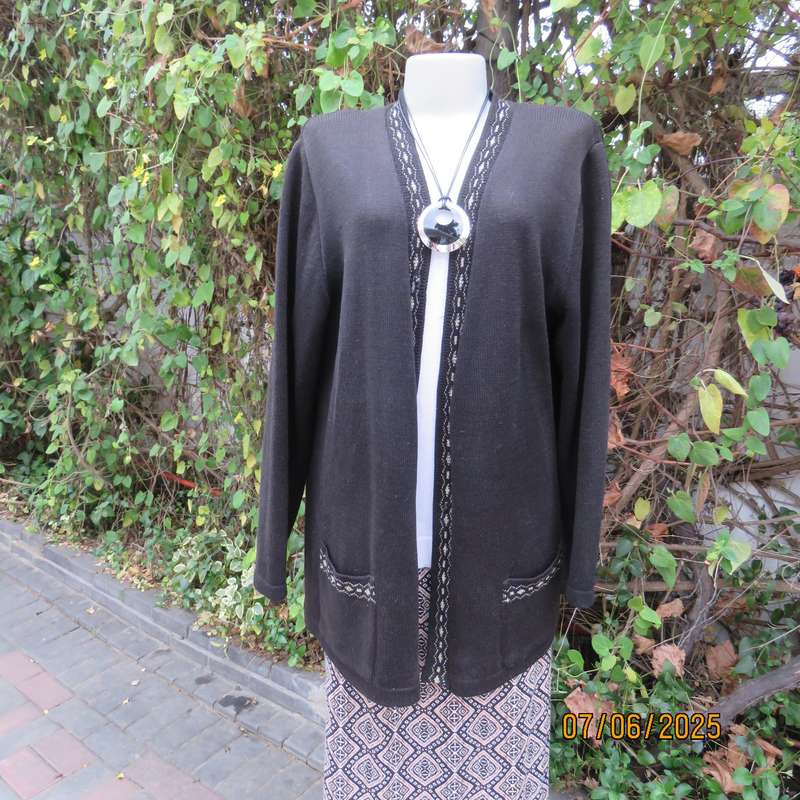 Black acrylic knit long sleeve knitted button down cardigan. Silver thread fronts-pockets. Size 44