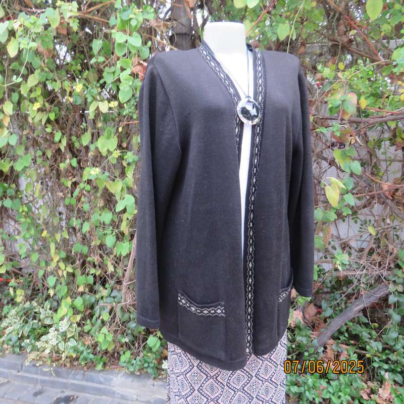 Black acrylic knit long sleeve knitted button down cardigan. Silver thread fronts-pockets. Size 44