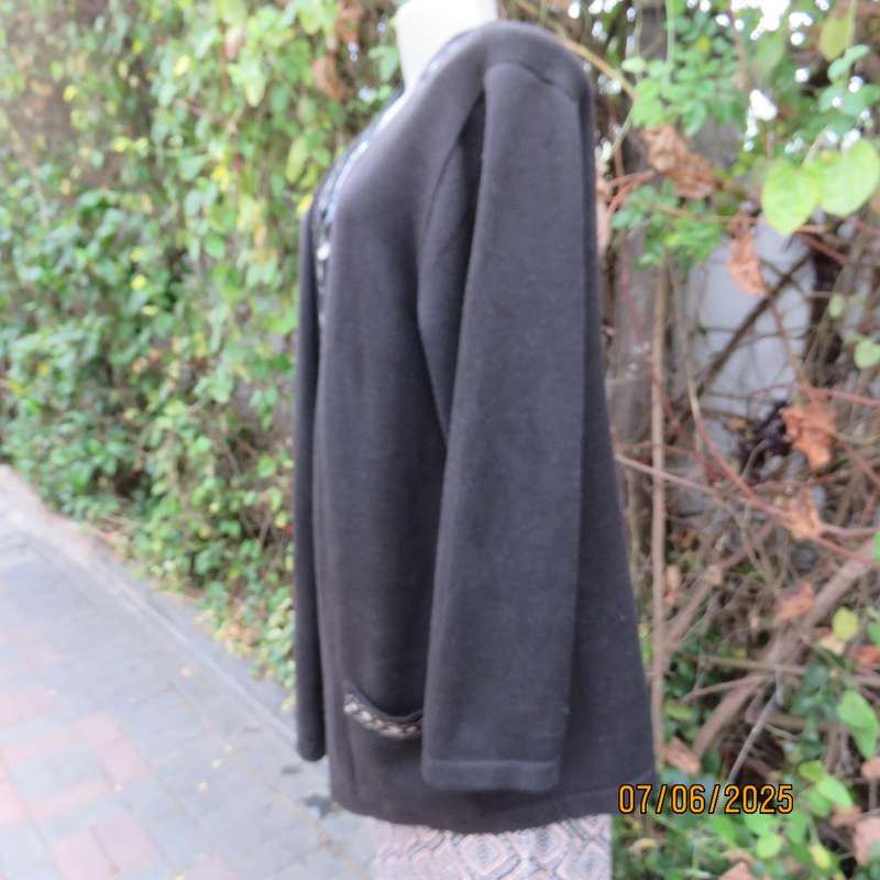 Black acrylic knit long sleeve knitted button down cardigan. Silver thread fronts-pockets. Size 44