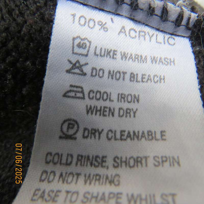Black acrylic knit long sleeve knitted button down cardigan. Silver thread fronts-pockets. Size 44