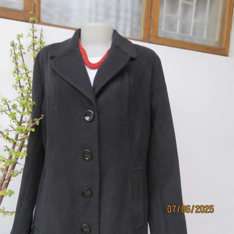 WOOLWORTHS very black woolen poly-viscose fully lined jacket. 4 button closure. Size 40