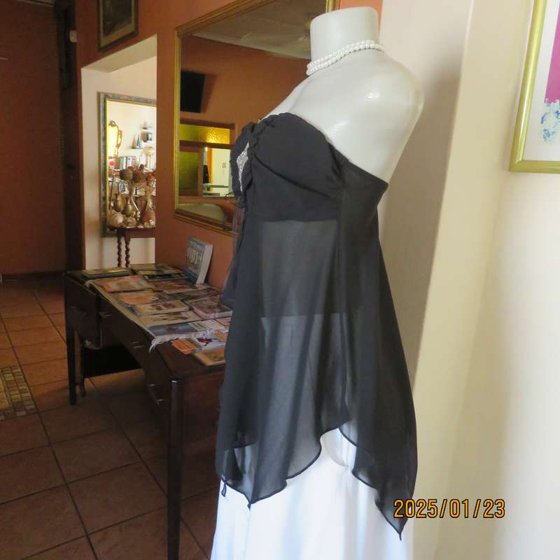 Luxury WWW black evening top size 32. Strapless. Bra area double.Rest sheer high-low polyester.