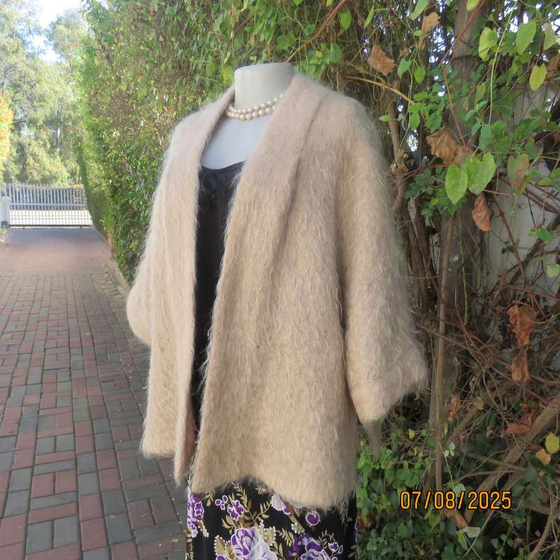 Pure mohair rich cream knitted jacket from Scotland. Size 38 to 42. Knit on elbow sleeves. Open