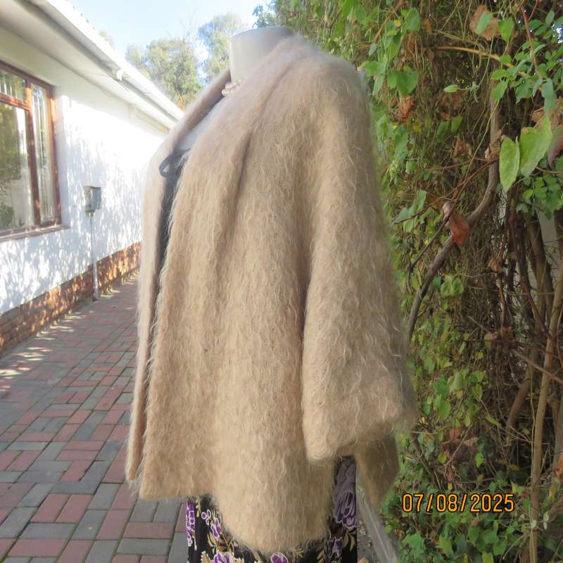 Pure mohair rich cream knitted jacket from Scotland. Size 38 to 42. Knit on elbow sleeves. Open