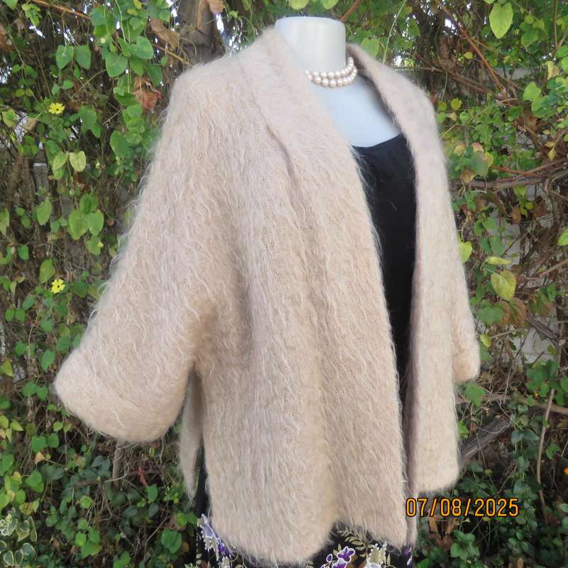 Pure mohair rich cream knitted jacket from Scotland. Size 38 to 42. Knit on elbow sleeves. Open