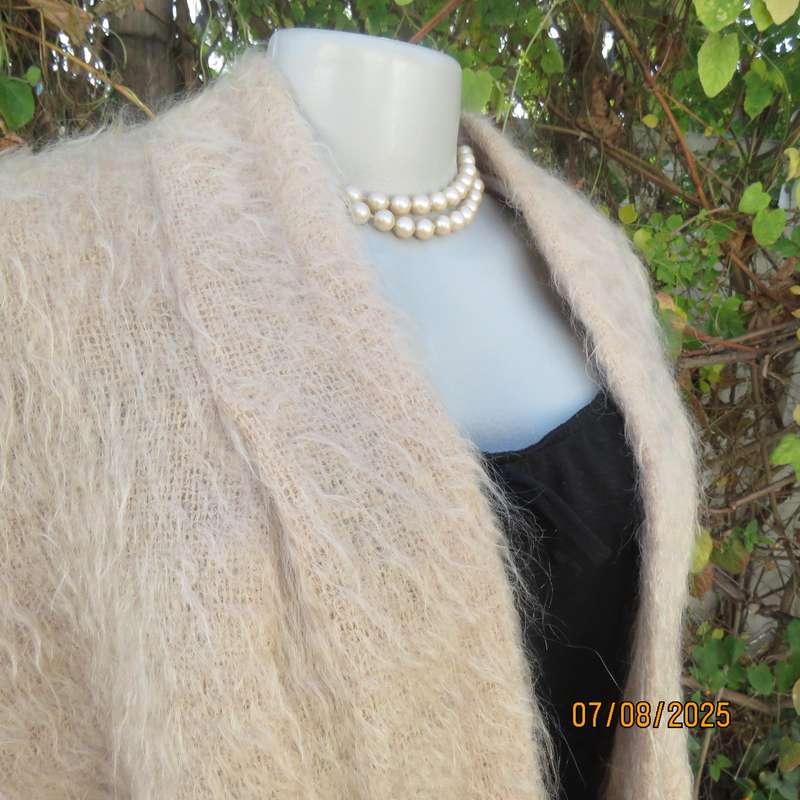 Pure mohair rich cream knitted jacket from Scotland. Size 38 to 42. Knit on elbow sleeves. Open