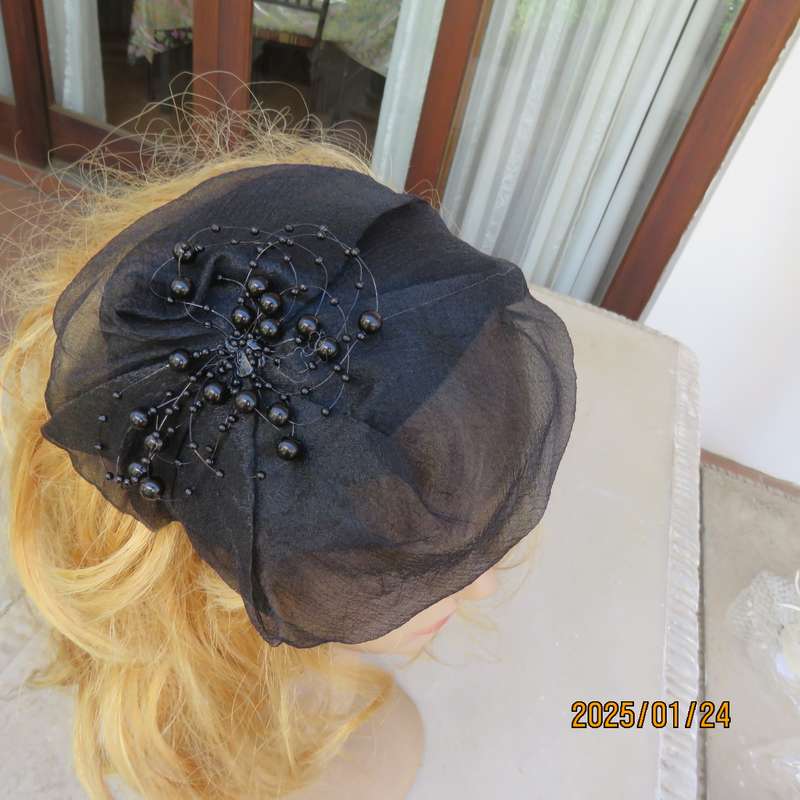 Stunning hand made black organza fascinator-hairband with bead decoration. New item.