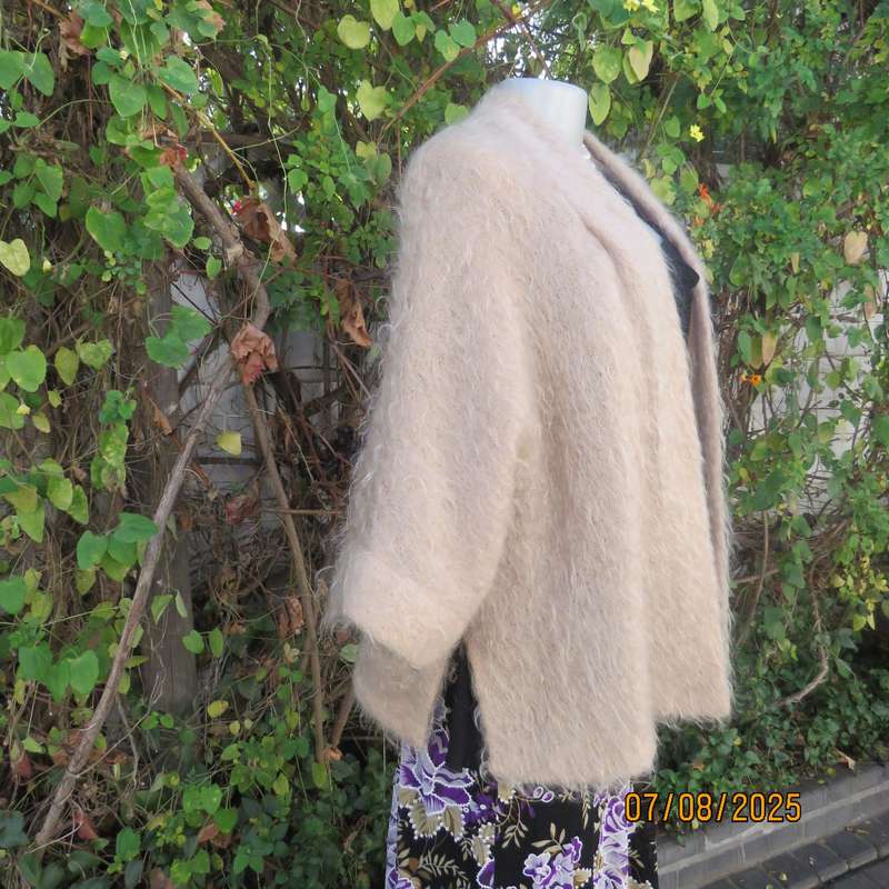 Pure mohair rich cream knitted jacket from Scotland. Size 38 to 42. Knit on elbow sleeves. Open