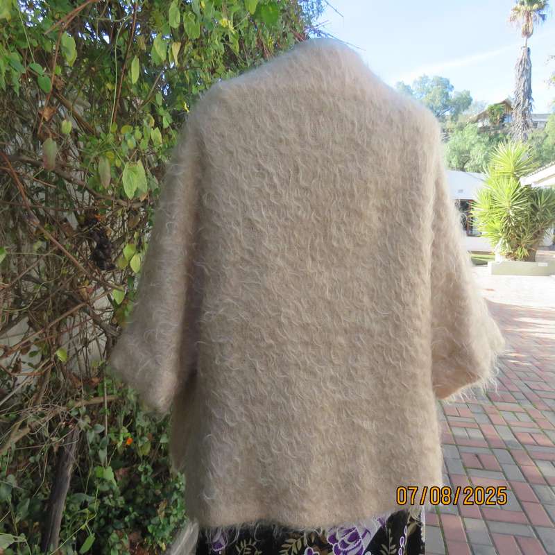 Pure mohair rich cream knitted jacket from Scotland. Size 38 to 42. Knit on elbow sleeves. Open