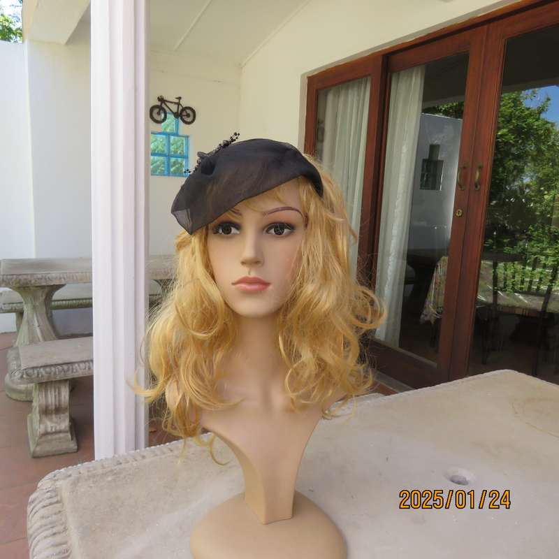 Stunning hand made black organza fascinator-hairband with bead decoration. New item.