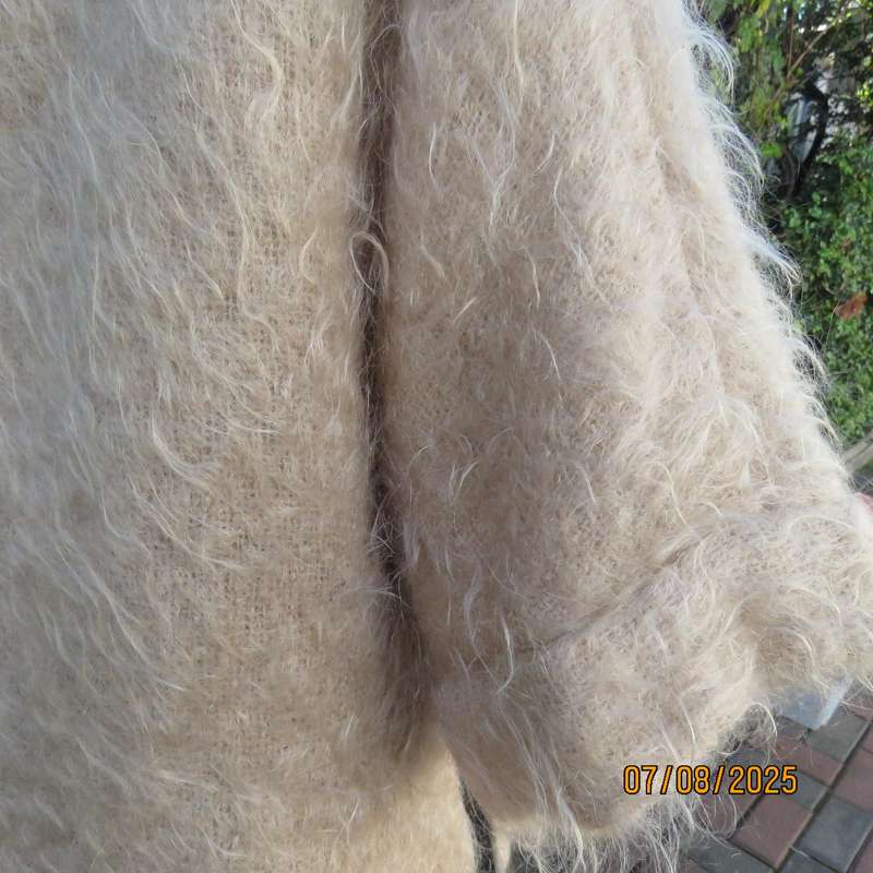 Pure mohair rich cream knitted jacket from Scotland. Size 38 to 42. Knit on elbow sleeves. Open