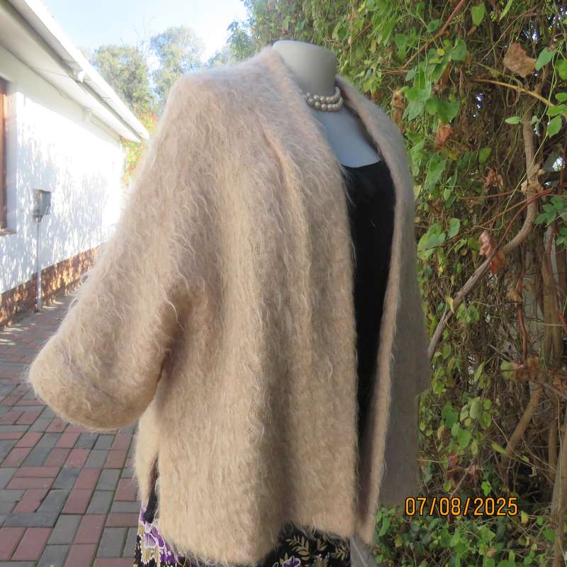 Pure mohair rich cream knitted jacket from Scotland. Size 38 to 42. Knit on elbow sleeves. Open