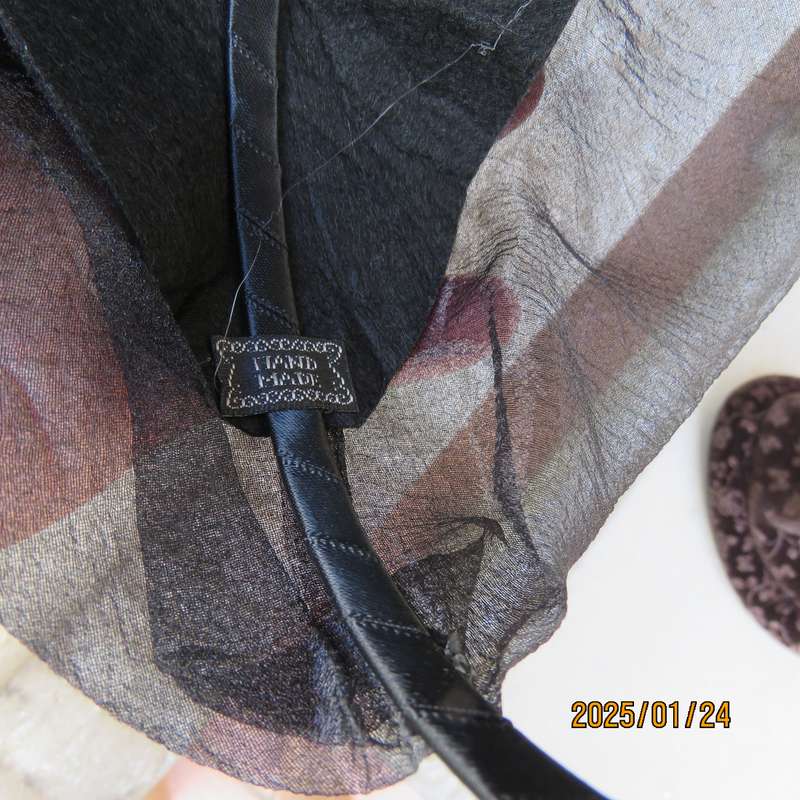 Stunning hand made black organza fascinator-hairband with bead decoration. New item.