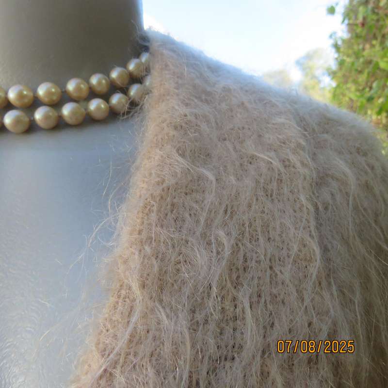 Pure mohair rich cream knitted jacket from Scotland. Size 38 to 42. Knit on elbow sleeves. Open