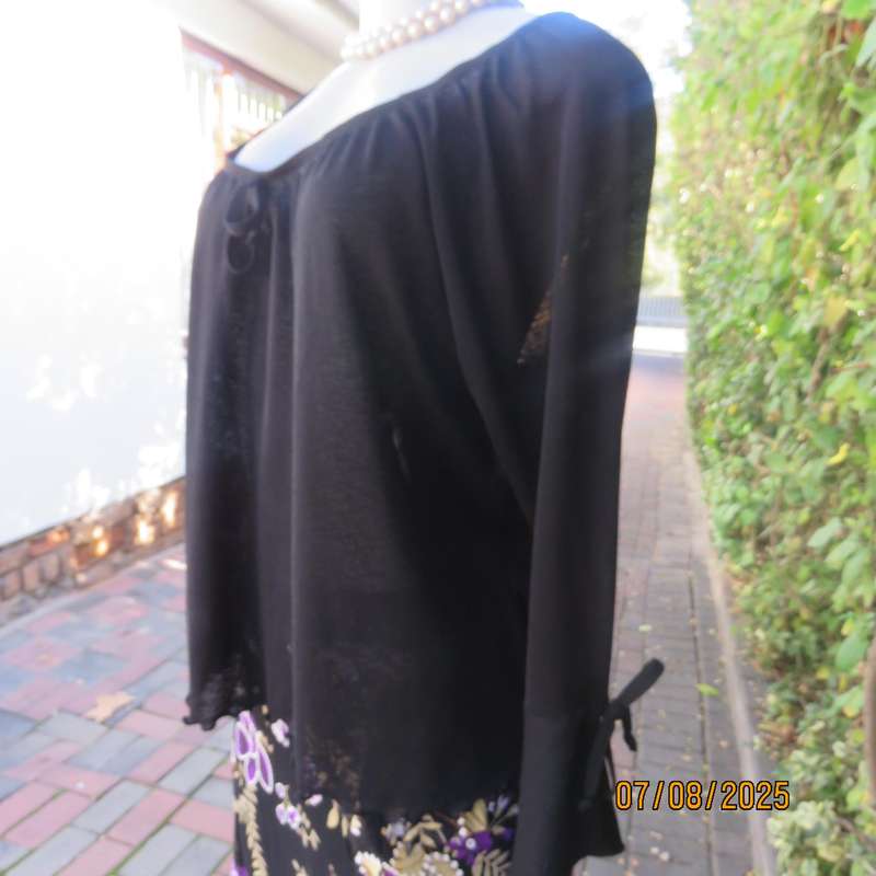 Black opaque polyester off the shoulder top with elasticated neckline. Size 42