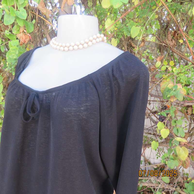 Black opaque polyester off the shoulder top with elasticated neckline. Size 42