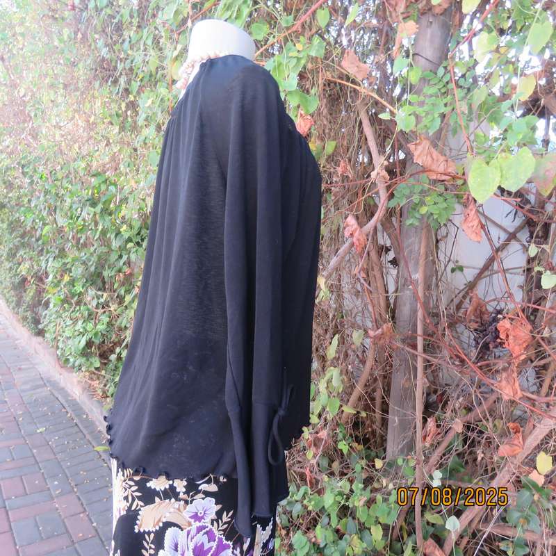Black opaque polyester off the shoulder top with elasticated neckline. Size 42