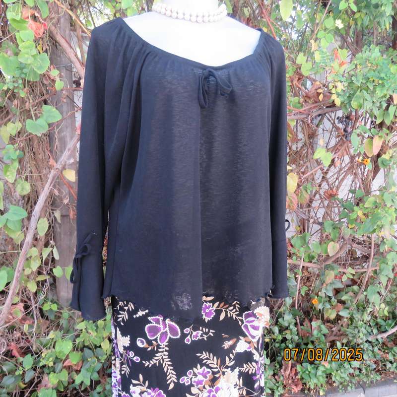Black opaque polyester off the shoulder top with elasticated neckline. Size 42