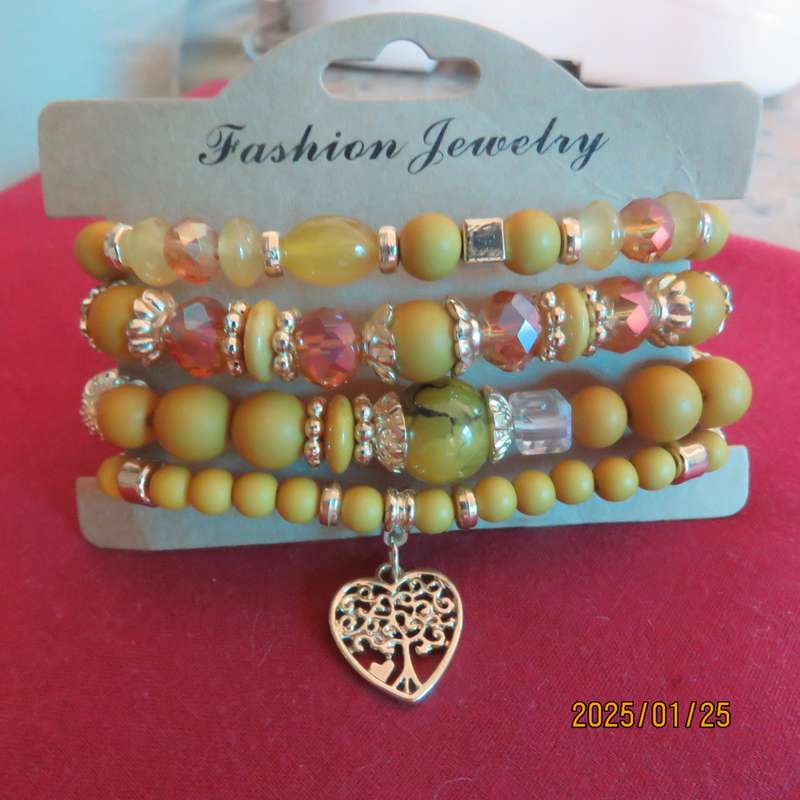 Luxury beaded set of 4 stretch autumn colour bangles with some gold. New item.