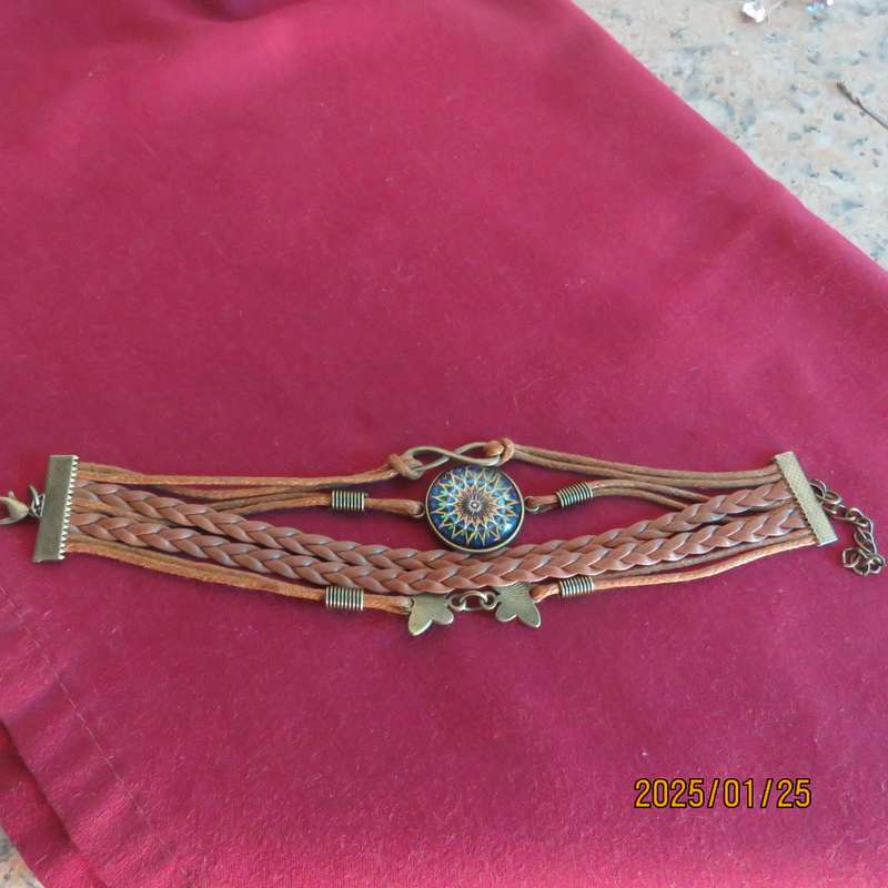 Bo-ho chic infinity adjustable bracelet with 5 faux leather straps. New item