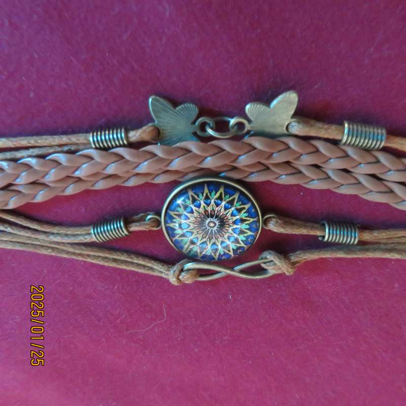 Bo-ho chic infinity adjustable bracelet with 5 faux leather straps. New item