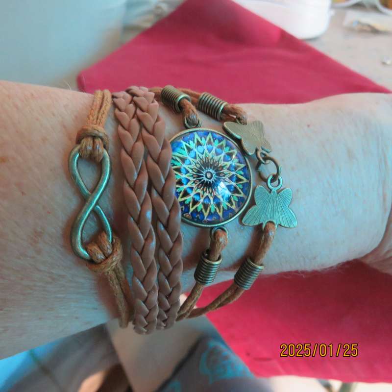 Bo-ho chic infinity adjustable bracelet with 5 faux leather straps. New item