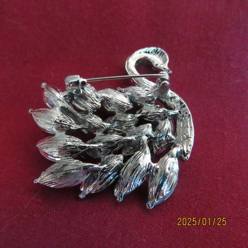 Elegant silver plated swan 4cm x 4cm brooch with purple stones and faux diamond neck area. New item