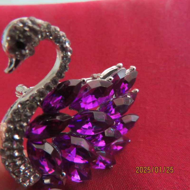 Elegant silver plated swan 4cm x 4cm brooch with purple stones and faux diamond neck area. New item