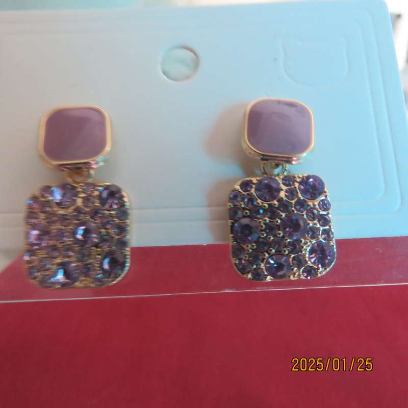 Cute pale violet drop and dangle earrings. Golden with bottom in tiny glimmer stones. New item