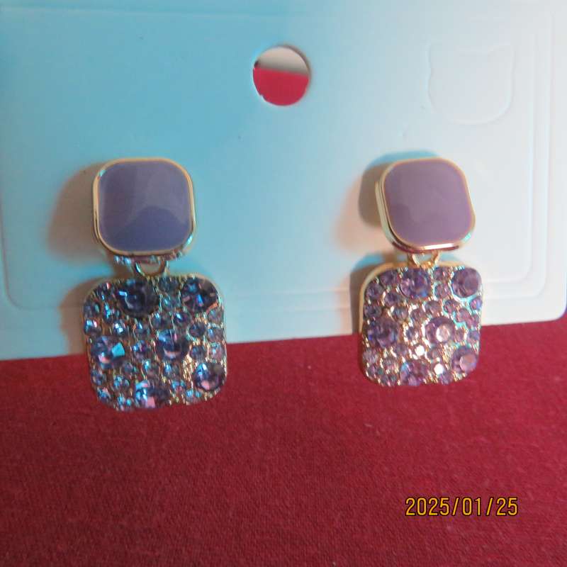 Cute pale violet drop and dangle earrings. Golden with bottom in tiny glimmer stones. New item
