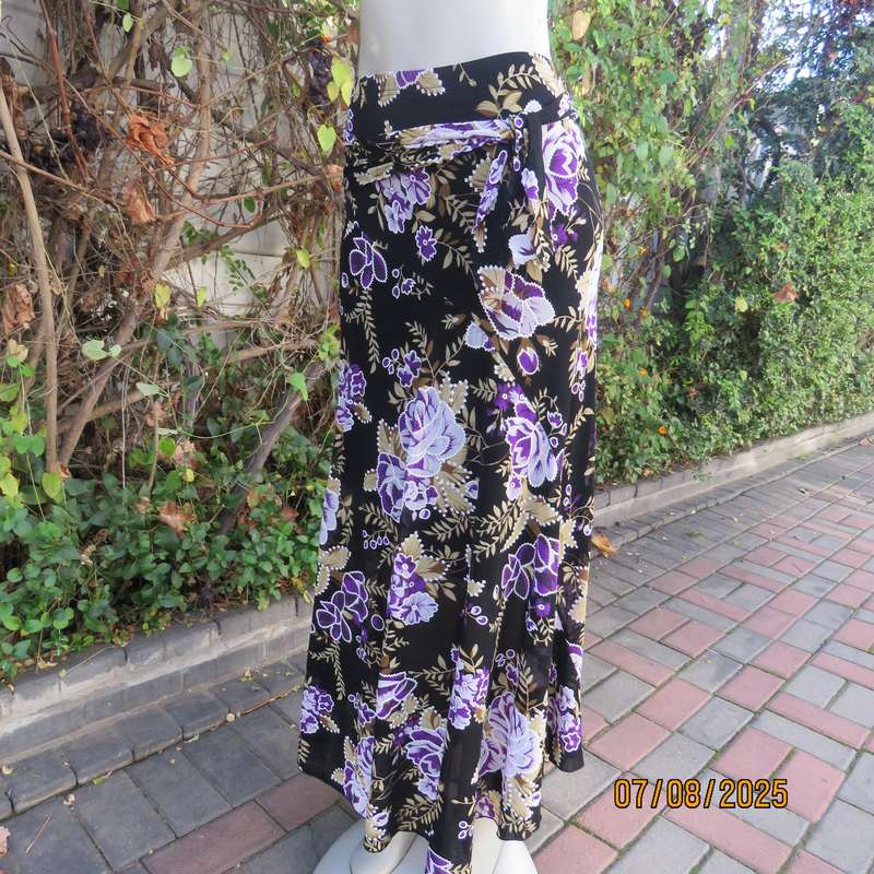 Black sheer stretch polyester maxi skirt with purple-grey roses. Wide bottom. Size 36