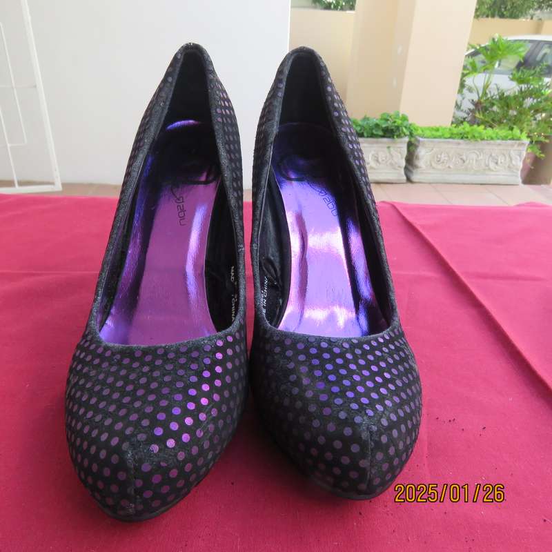 Pair black velvety pumps with shiny purple polkadots. Size 4 by Free 2byou. Good condition