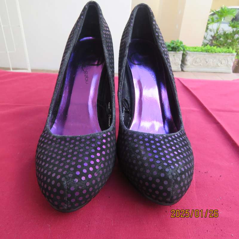 Pair black velvety pumps with shiny purple polkadots. Size 4 by Free 2byou. Good condition