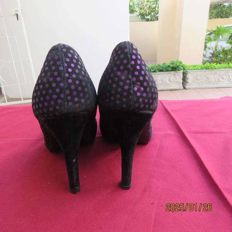 Pair black velvety pumps with shiny purple polkadots. Size 4 by Free 2byou. Good condition