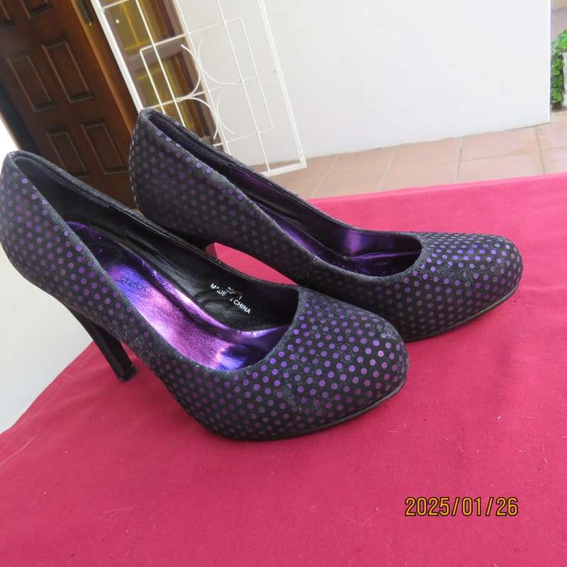 Pair black velvety pumps with shiny purple polkadots. Size 4 by Free 2byou. Good condition