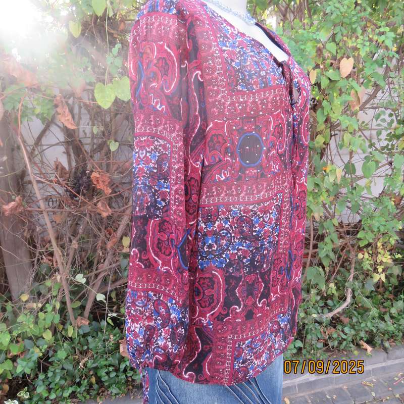 Maroon sheer polyester paisley-floral print in blue-white long sleeve top. Size 42.