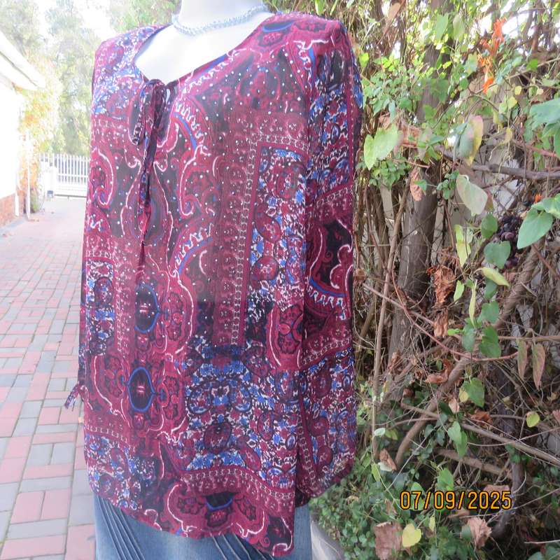 Maroon sheer polyester paisley-floral print in blue-white long sleeve top. Size 42.