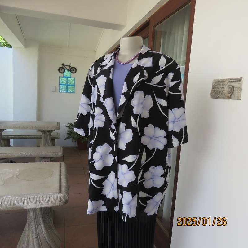 PARK AVENUE  short sleeve top-jacket. Black with very pale lilac flowers. Size 44.One button closure