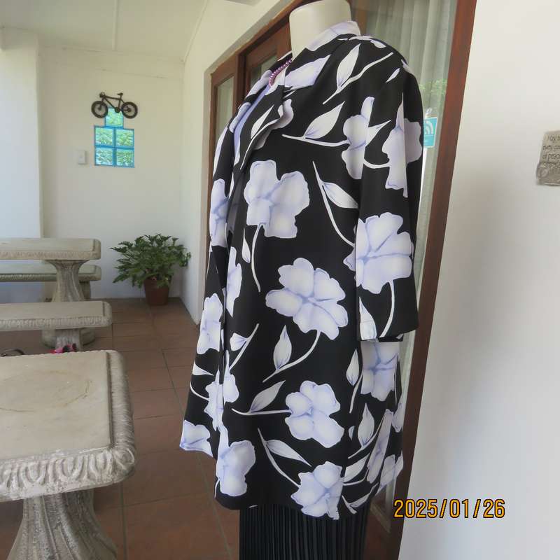 PARK AVENUE  short sleeve top-jacket. Black with very pale lilac flowers. Size 44.One button closure