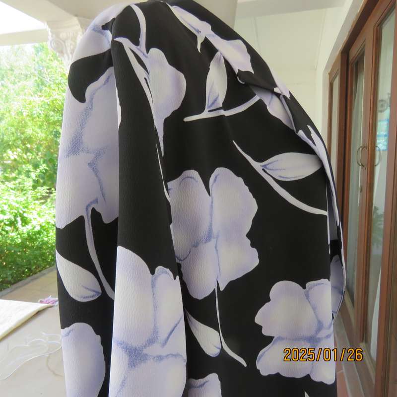PARK AVENUE  short sleeve top-jacket. Black with very pale lilac flowers. Size 44.One button closure