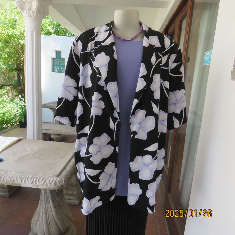 PARK AVENUE  short sleeve top-jacket. Black with very pale lilac flowers. Size 44.One button closure