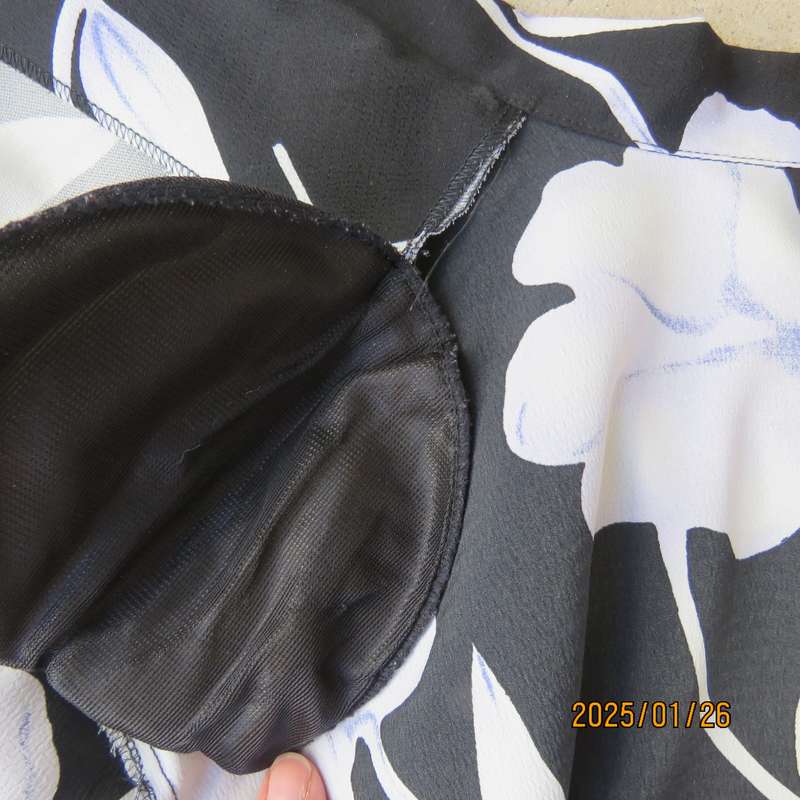 PARK AVENUE  short sleeve top-jacket. Black with very pale lilac flowers. Size 44.One button closure