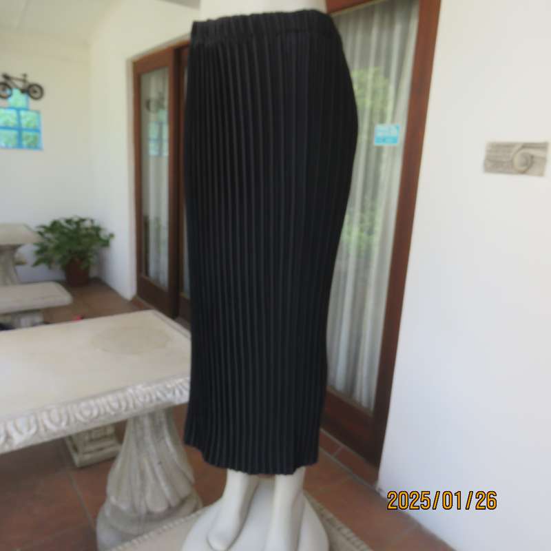 CHARISMA black fine permanent pleated polyester skirt size 36 with elasticated waist. Ankle length