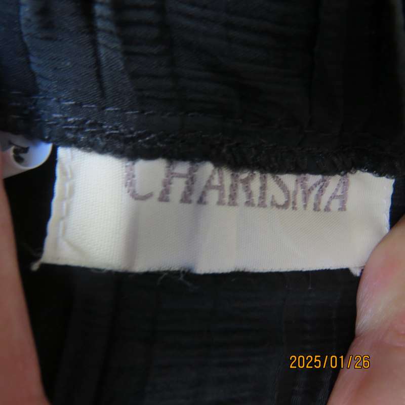 CHARISMA black fine permanent pleated polyester skirt size 36 with elasticated waist. Ankle length