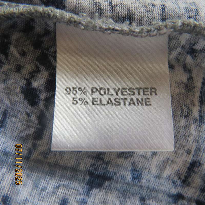 Slip over polyester stretch pattern blocked top in shades of blue-white-grey. High neck. Size 36