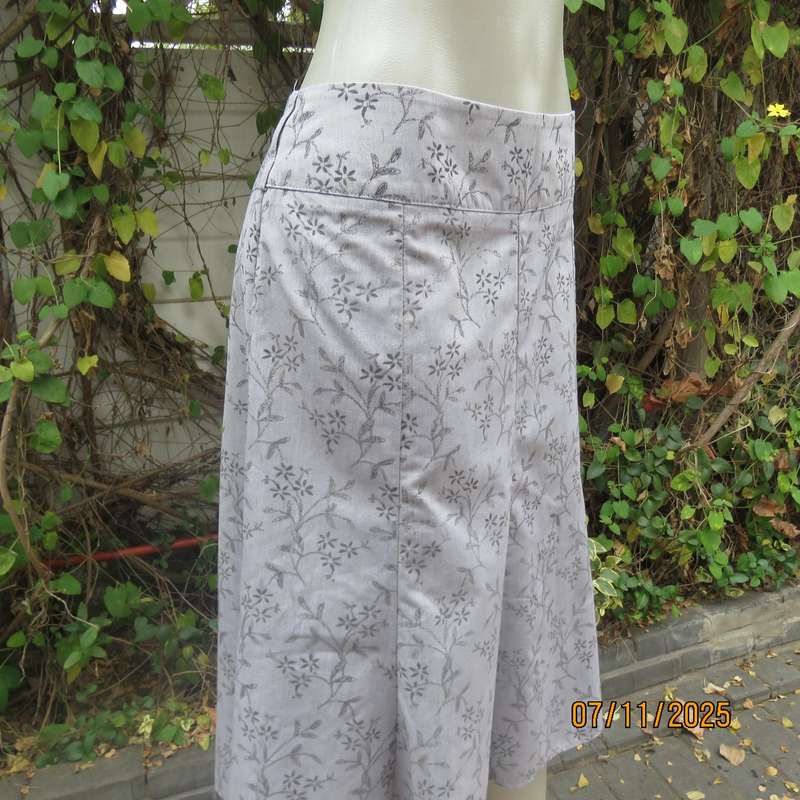 EXACT silver grey A Line paneled skirt with darker grey tiny flowers. Size 38.