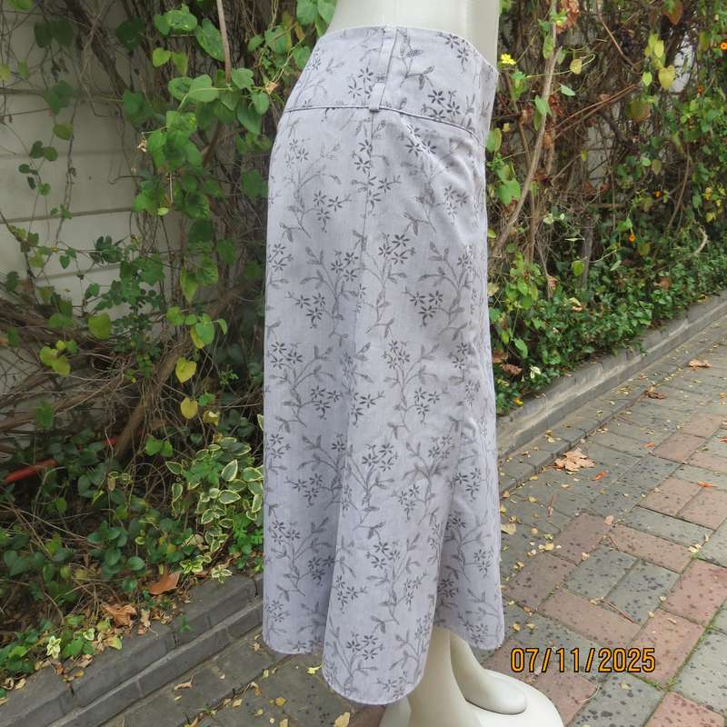 EXACT silver grey A Line paneled skirt with darker grey tiny flowers. Size 38.